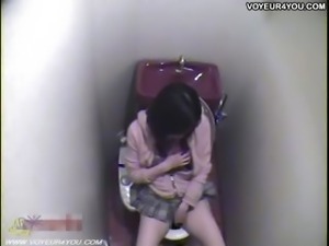 Japanese girl masturbating hard on toilet