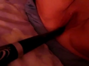Inserting a baseball bat into her fat cunt