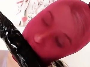 Good-looking blonde Kelly Candy red shiny mask on her face