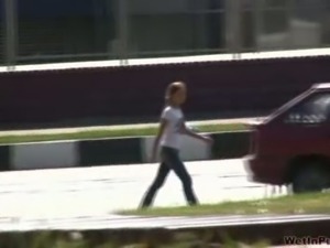 Long-haired teen pees in her jeans in the park and changes her clothes