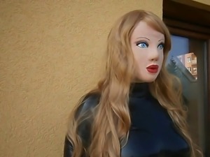 Masked latex doll with blond wig