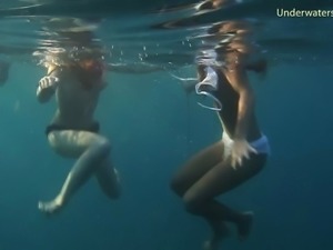 Lustful babes enjoy showing off their bodies underwater