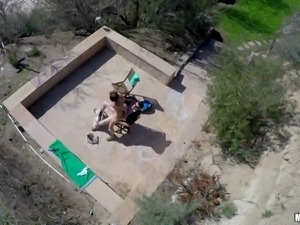 Drone and a POV camera film the girl fucking outdoors
