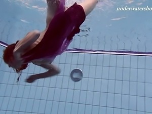 Sizzling redhead girl Ala swimming all naked in hot underwater show