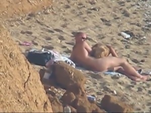 Peek video of lusty all nude couple fucking missionary on the beach
