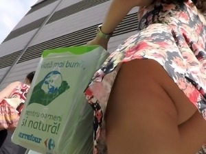 Gorgeous young brunette with a perfect ass upskirt outside