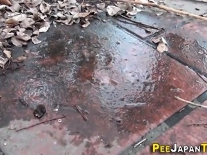 Asians piss puddles outdoors