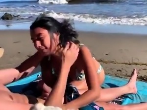 Bodacious babe takes a meat stick for a ride on the beach