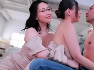 Two buxom Asian girls in lingerie share their lust for cock
