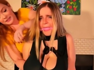 Lesbian femdom massaging and milking slave's big boobs