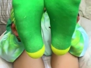 Naughty teen peels off her socks and exposes her sexy feet