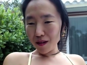 Asian enjoys outdoor masturbation